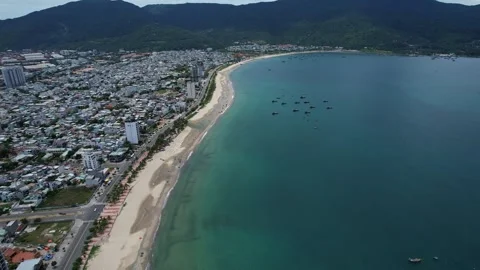 A breathtaking aerial view of a cityscape surrounded by a vast body of water Da Stock Footage 295197929