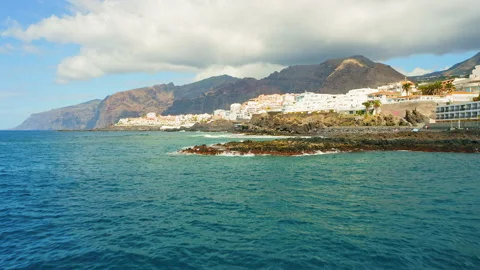 Breathtaking aerial view dramatic mountains, blue ocean waves splash roll on Video stock 221129815