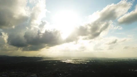 A breathtaking aerial view of a dramatic sunset sky with golden sunlight Stock Footage 320956843