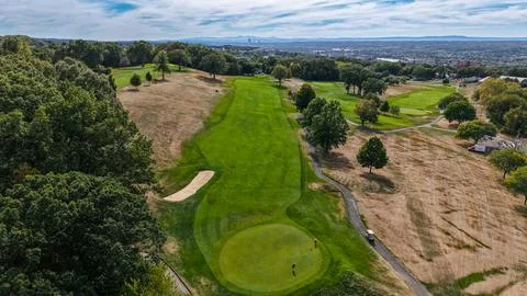 Breathtaking aerial view of a golf course under a clear blue sky Stock Photos
