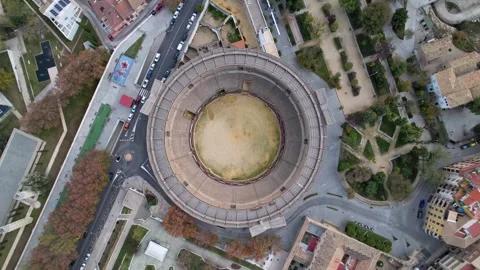 Breathtaking Aerial View of an Impressive Ancient Amphitheater in a Bustling Stock Footage 323972798