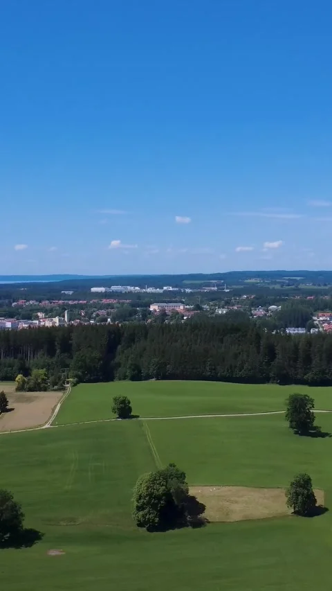 Breathtaking Aerial View of Lush Fields and Peaceful Countryside in Summer Stock Footage 311112133