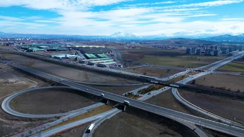 A breathtaking aerial view of a massive intersection, showcasing the dynamic flo 動画素材 303628384