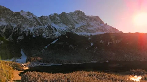 Breathtaking aerial view over snow-covered treetops in Germanys Bavarian Alps Vídeo Stock 316629251