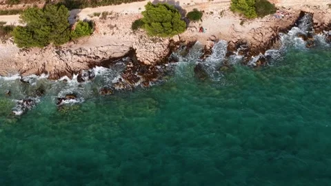 Breathtaking aerial view of pristine Mediterranean coastline, where emerald Video stock 317449658