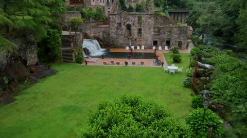 Breathtaking aerial view of a sophisticated stone estate featuring ruins Stockbeeldmateriaal 336287053