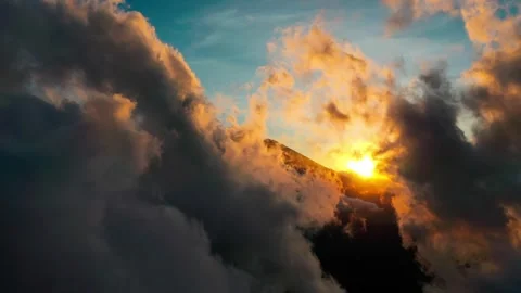 Breathtaking Aerial View Of Sun Setting Behind Dark Stormy Clouds And Hill Video stock 329655298