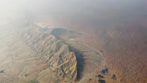 Breathtaking Aerial View of UAE Mountains and Sand Dunes in Afternoon Light Stock Footage 333139518