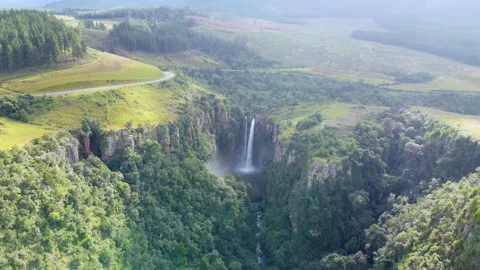 Breathtaking aerial view of Waterfall through sunrays Video stock 260653704