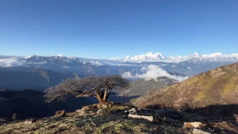 Breathtaking alpine landscape with clouds flowing over mountains Stock Footage 333806927