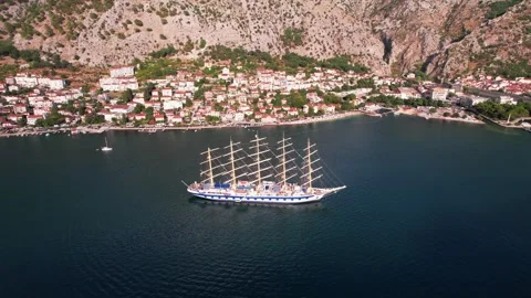 Breathtaking Arial View of a Sailing Ship Docked in Kotor, Montenegro Stock Footage 320747879