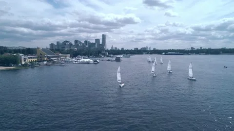 Breathtaking bird's eye view of yachts, racing on the river towards the camera Stock Footage 201389636