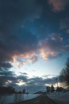 Breathtaking blaze of the setting sun over the fjords and snow-covered moun.. Stock-Fotos