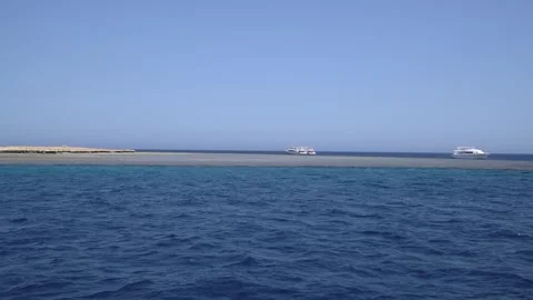 A breathtaking blue seascape featuring multiple yachts anchored near Giftun I Stock Footage 294975852