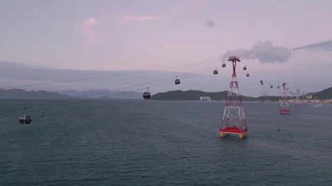 Breathtaking cable car ride over water at sunset near Hong Kong Stock Footage 308246800