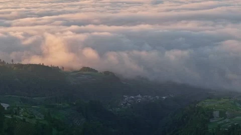 Breathtaking cloud inversion above mountain valleys during sunrise. Видео 336769097