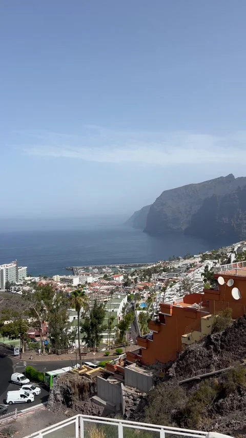 Breathtaking Coastal View Featuring Cliffs and a Charming Town Beneath the Stock Footage 318714118