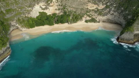 Breathtaking Drone Shot Cliffs and Sunset Kelingking Beach 4K Видео 339598303