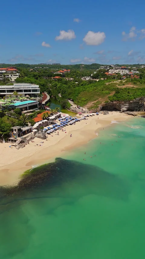 Breathtaking Drone Shot Melasti Beach Clubs Turquoise Ocean 4K Stock Footage 340404878
