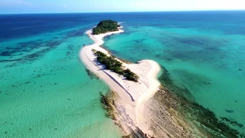 Breathtaking drone shot of a remote island paradise . Видео 332827879