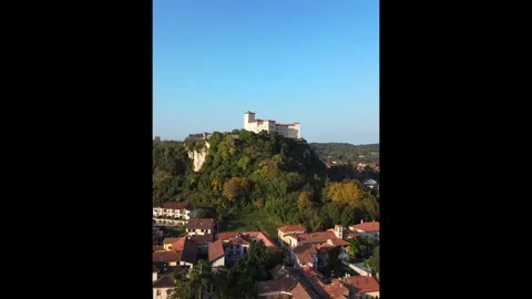 Breathtaking drone view of the city of Angera overlooking Lake Maggiore Stock Footage 319966936