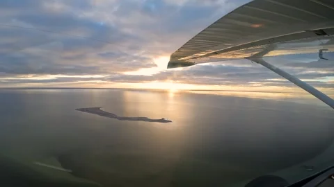 Breathtaking Golden Hour Flight Over Rare Water-Filled Lake Eyre in Outback Stock Footage 312685602