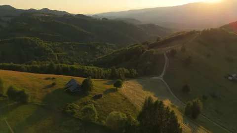 Breathtaking hayfields and rustic wooden barns in the tranquil Carpathian m.. Vídeo Stock 331604953