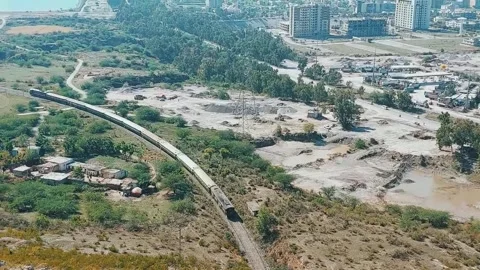 Breathtaking High Angle View of Train Journeying Through Islamabad Pakistan Stock Footage 333542924