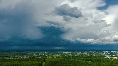 Breathtaking Hyperlapse of Dark Storm Clouds Over a Town Video stock 315549722