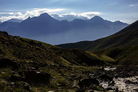 A breathtaking landscape showcasing the contrast between the rugged mountai.. Stock Photos