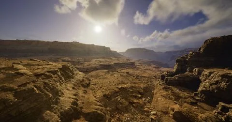 Breathtaking landscape view of rugged terrain at sunset near canyon Stock Illustration