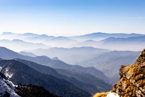 Breathtaking mist covered mountain range at morning 스톡 사진