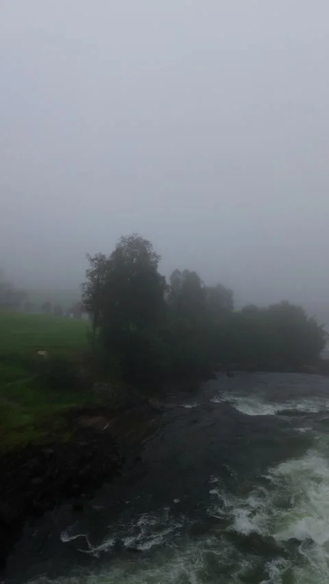 Breathtaking Misty River Scene with Flowing Water and Fog in Norway Vídeos de archivo 296007302