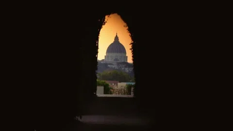 A breathtaking moment captures the iconic dome of Vatican framed by lush Stock Footage 284561300