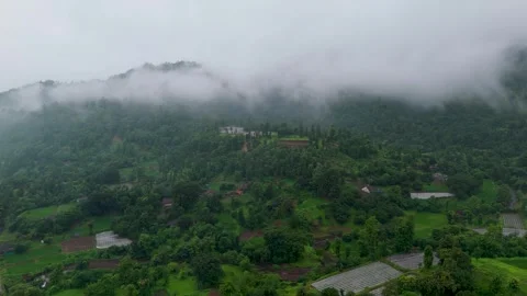 A breathtaking monsoon landscape featuring lush green forest-covered hills. Stock Footage 343561509