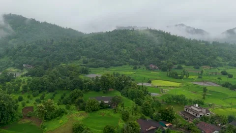 A breathtaking monsoon landscape featuring lush green forest-covered hills. Stock Footage 343561559