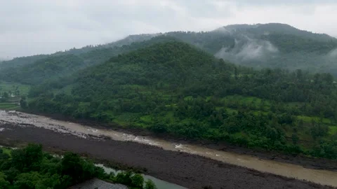 A breathtaking monsoon landscape featuring lush green forest-covered hills. Stock Footage 343561696