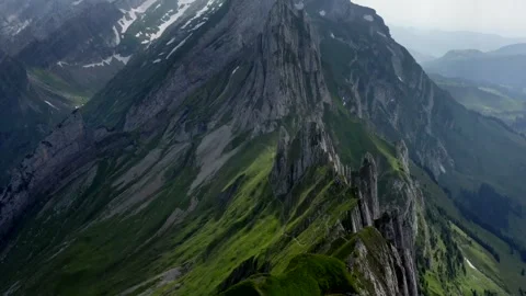 Breathtaking Mountain Landscape With Dramatic Peaks and Lush Greenery Stock Footage 323270579