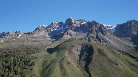 Breathtaking mountain landscape showcasing greenery and rugged peaks under a Video stock 314080832
