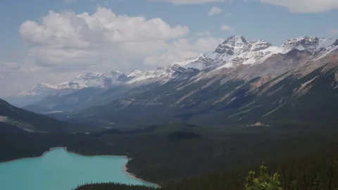 Breathtaking Mountain Range and Turquoise Lake in Pristine Wilderness Stock Footage 255545562