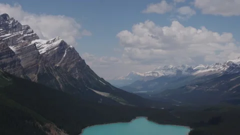 Breathtaking Mountain Range and Turquoise Lake Panoramic View Stock Footage 255626305