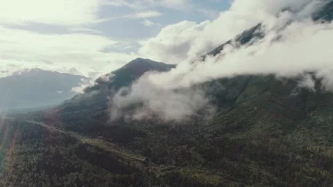 Breathtaking mountain views with clouds and greenery in daylight Video stock 320265061
