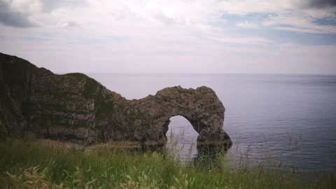 The breathtaking Natural Arch located at Durdle Door showcases a stunning Stock Footage 293677917