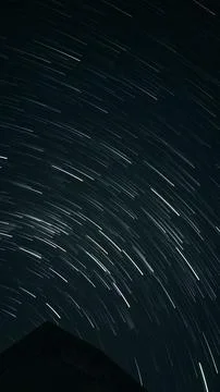 Breathtaking night sky displaying an array of stars streaking across a majestic Stock Photos