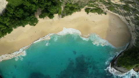 Breathtaking Ocean Cliffs and Secret Beach Kelingking Aerial Stock Footage 339584292