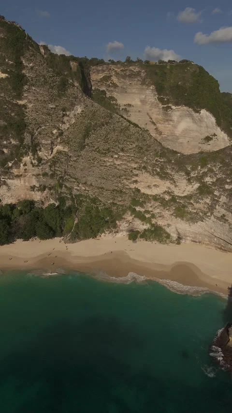 Breathtaking Ocean Cliffs and Secret Beach Kelingking Aerial Stock Footage 340407325