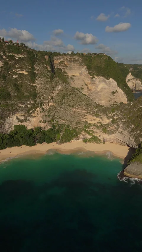 Breathtaking Ocean Cliffs and Secret Beach Kelingking Aerial Stock Footage 340407520