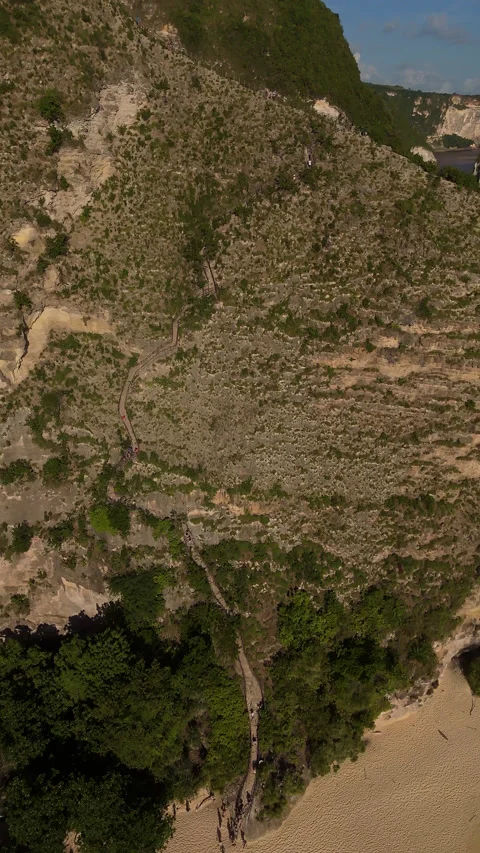 Breathtaking Ocean Cliffs and Secret Beach Kelingking Aerial Vídeo Stock 340409915