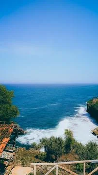 Breathtaking Ocean Cliffside View With Waves Crashing Below Stock Photos