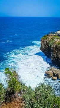 Breathtaking Ocean Cliffside View With Waves Crashing Below Stock Photos